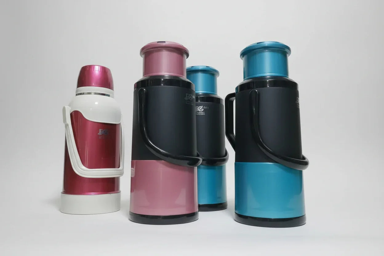 Collection of colorful thermos bottles on a shelf
