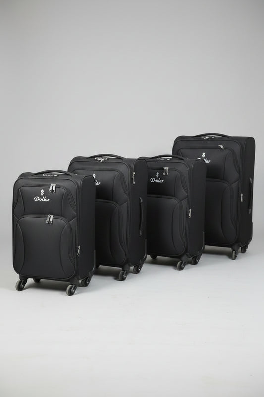Row of black suitcases with a visible brand logo on a concrete floor.