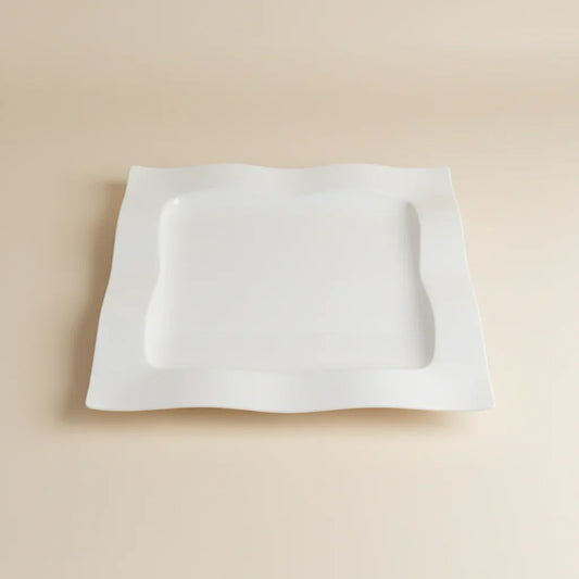 White square object on a red stool with a blurred background