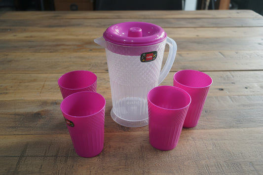Pink plastic cups on a stand with packaging in the background