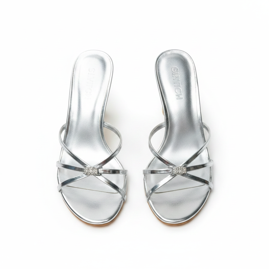 Silver strappy sandals with a neutral background