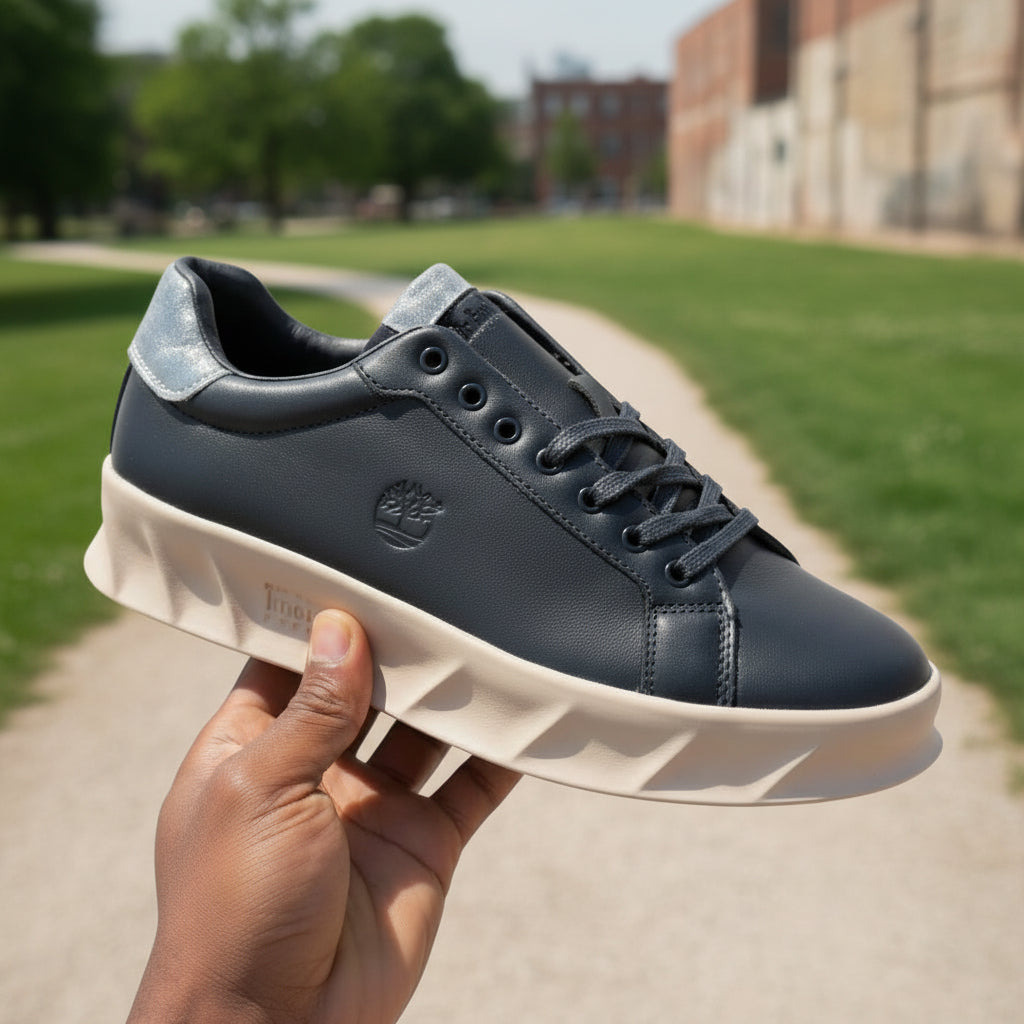 A timberland placed in someone's hand on the street .