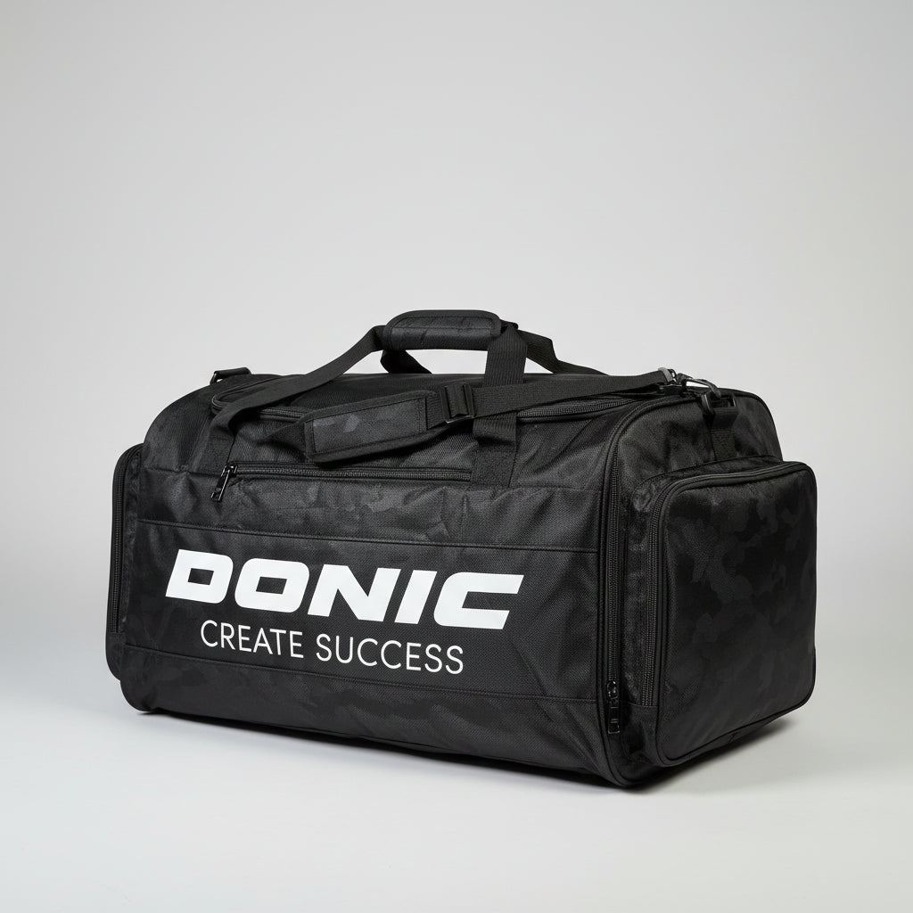 Black duffel bag with 'Bonac' branding on a pile of suitcases.