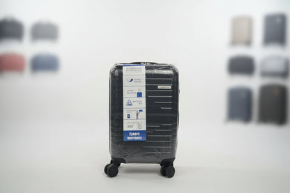 Black luggage filter with a label on a textured surface
