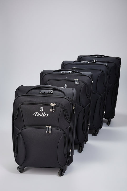 Row of black suitcases with 'Dollar' branding in a storage area.