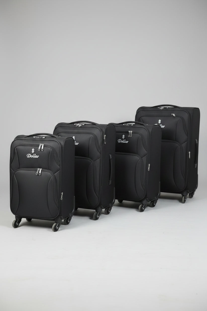 Row of black suitcases with a visible brand logo on a concrete floor.