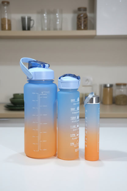 Two orange and blue bottles with measurement markings on a wooden surface.