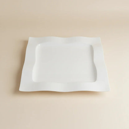 White square object on a red stool with a blurred background