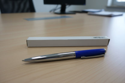 blue silver pen placed on office table 