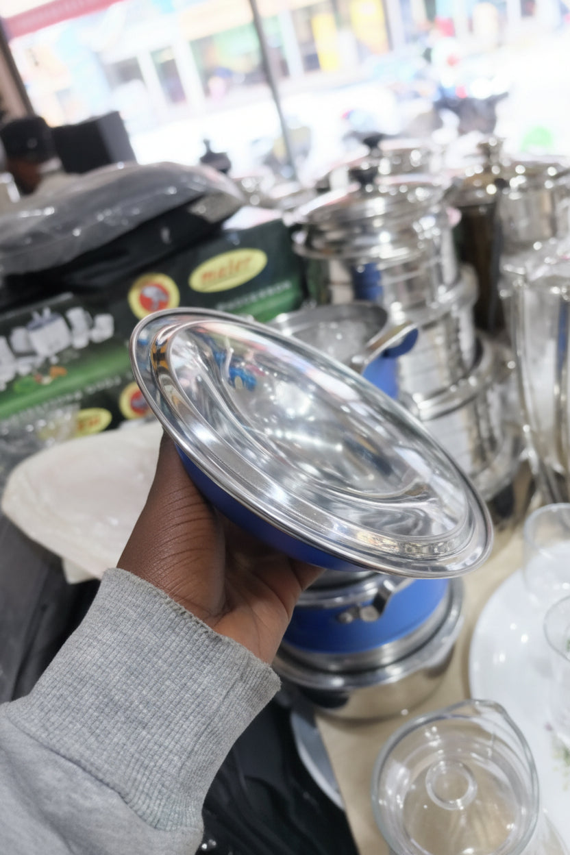 Metallic filter held by a hand with a blurred background