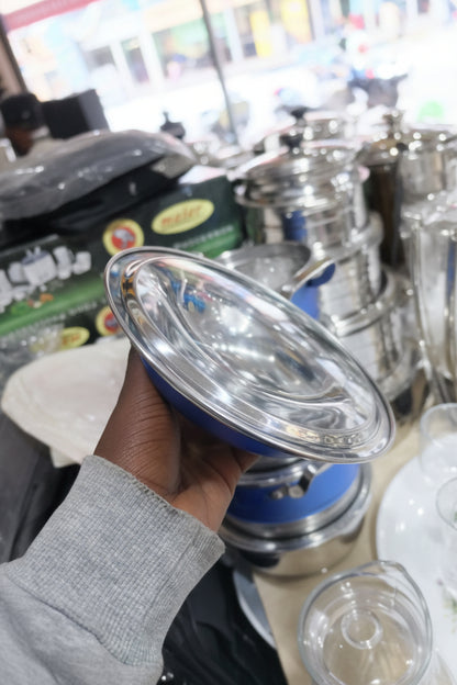 Metallic filter held by a hand with a blurred background