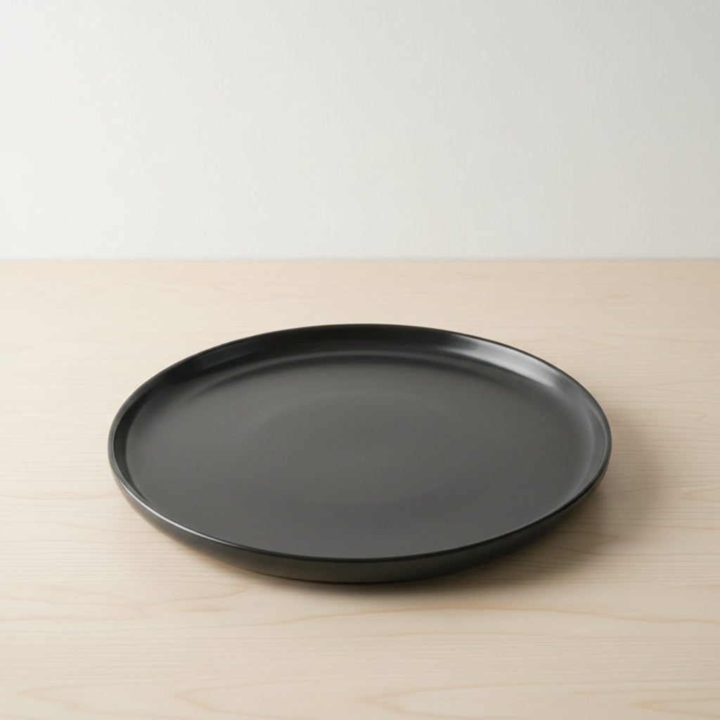 Black lid on a red stool with a cluttered background