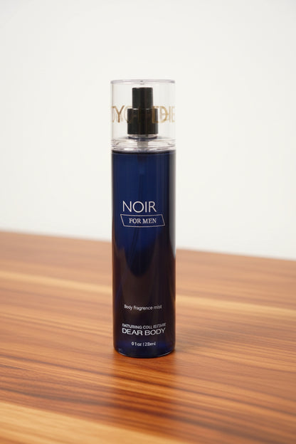 Black bottle of Noir for Men cologne on a white background