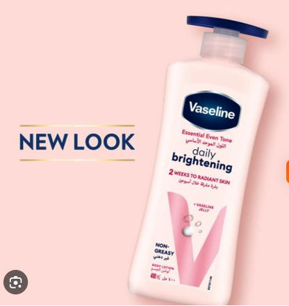 Vaseline daily brightening lotion bottle on a pink background