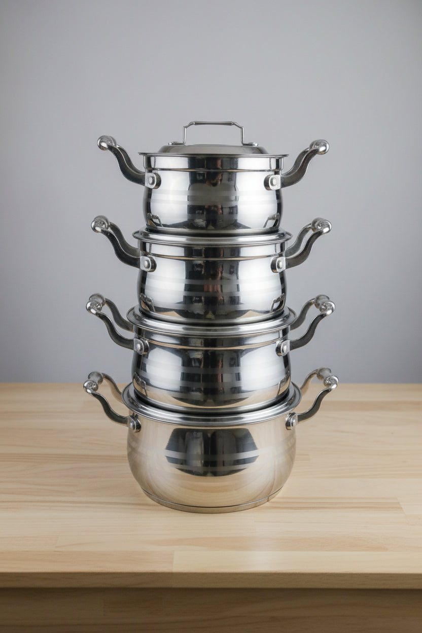 Metallic valve or fitting on a blurred background with various items.