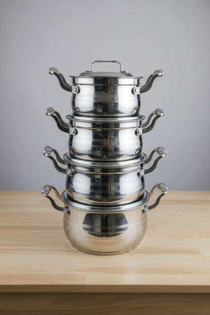 Metallic valve or fitting on a blurred background with various items.