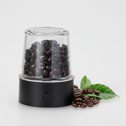 Black coffee grinder with coffee beans and a glass container on a white background