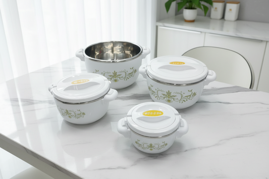 Set of white ceramic containers with floral patterns on a reflective surface