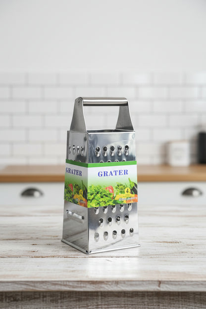 Metal grater held by a hand with a blurred background