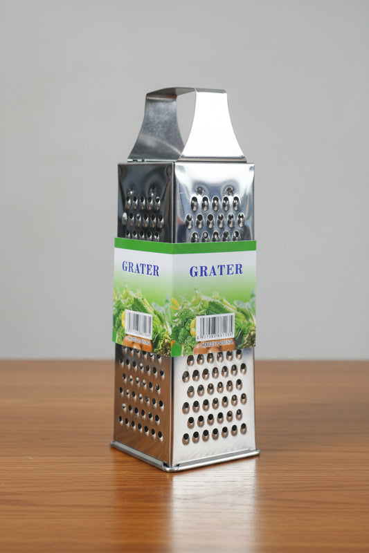 Hand holding a box of a grater with a blurred store background