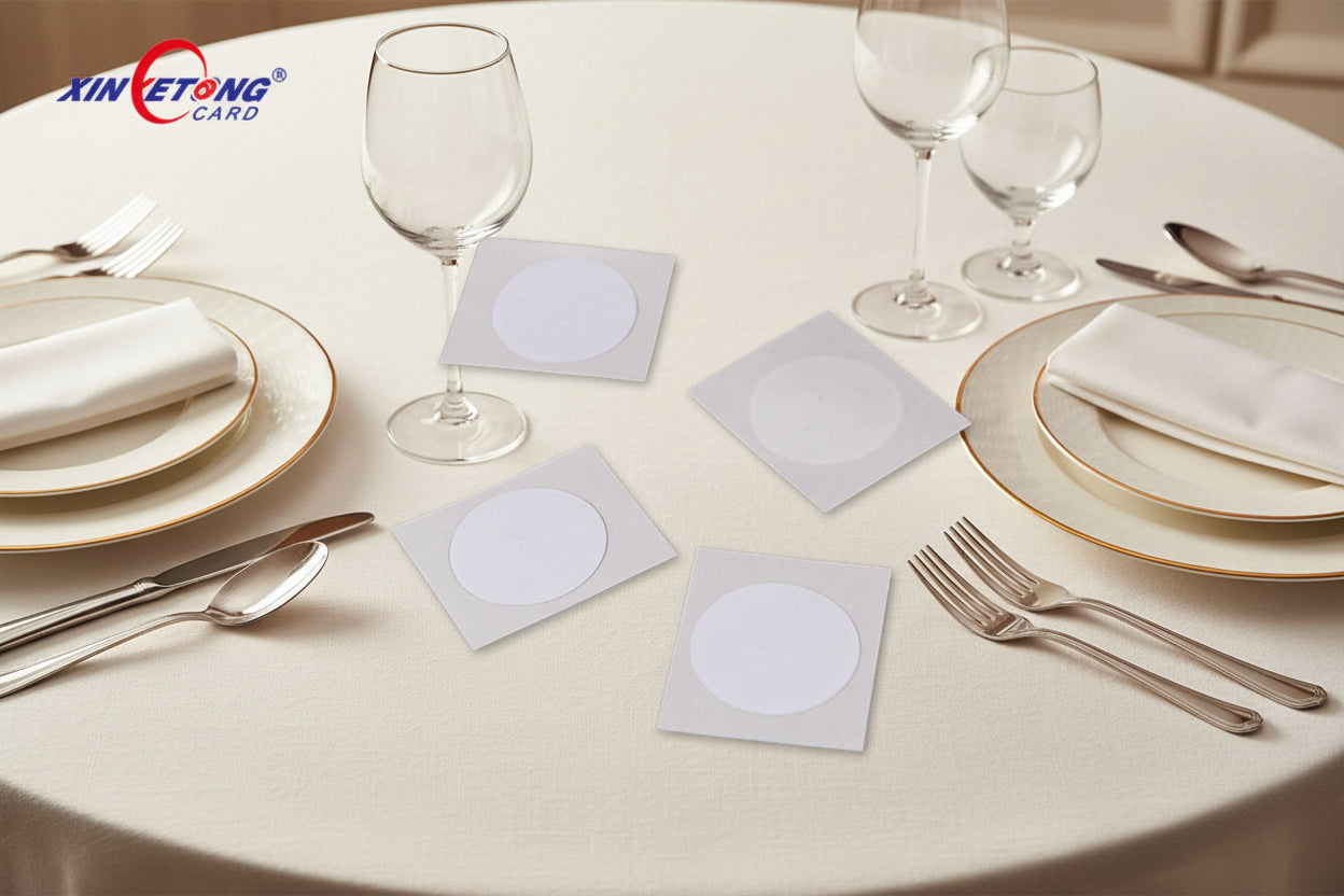 Four white square cards with circular cutouts on a white background, featuring the Xinetong logo.