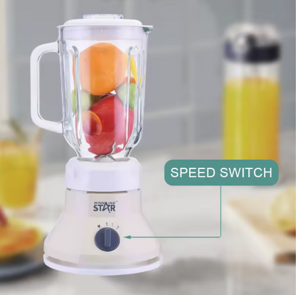 Blender with fruits inside on a kitchen counter, featuring a speed switch label.